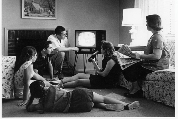 Your typical family evening: gathered around the television.